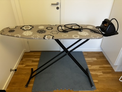 Ironing board with iron